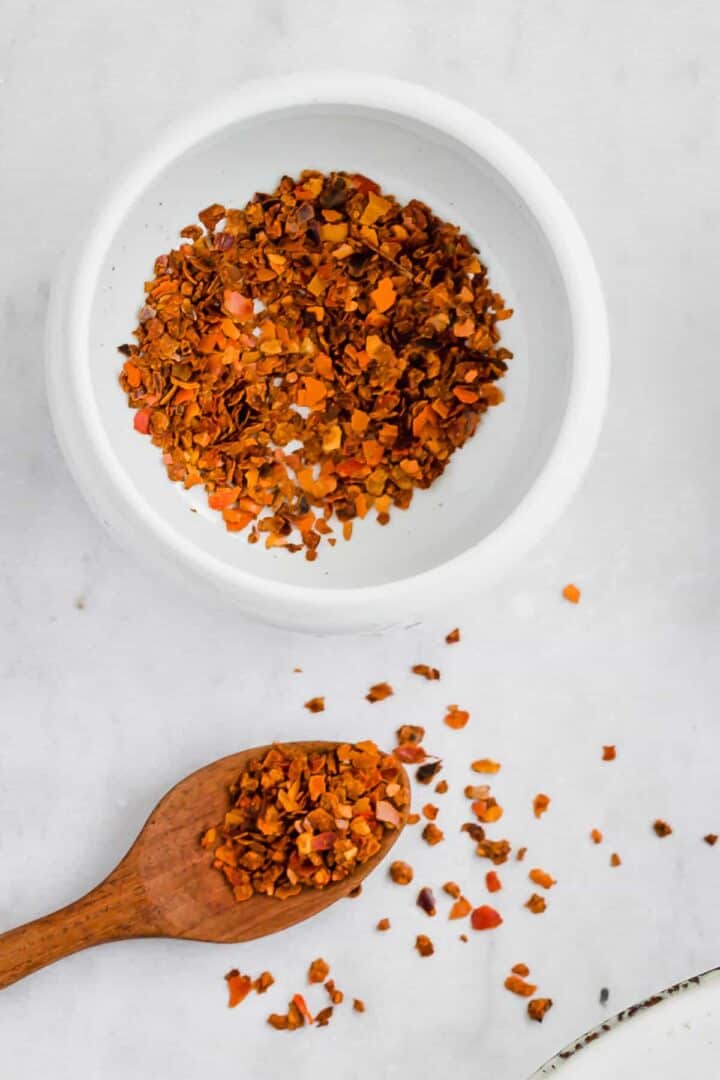 red pepper flakes in a blue bowl