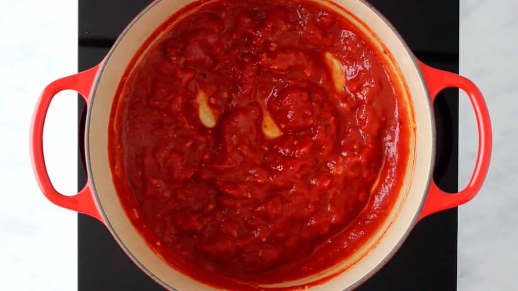cooked arrabiata sauce in a red pot