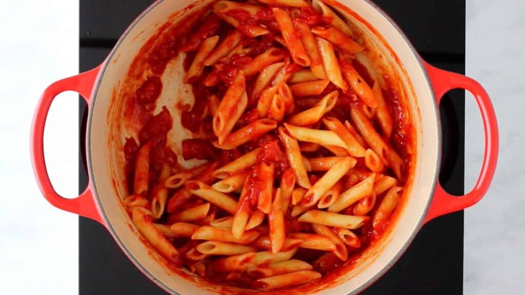 cooked pasta arrabiata in a red pot