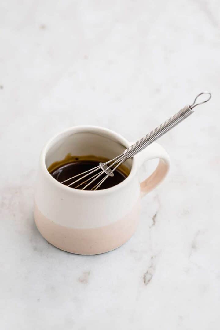 green salad dressing in a small jar