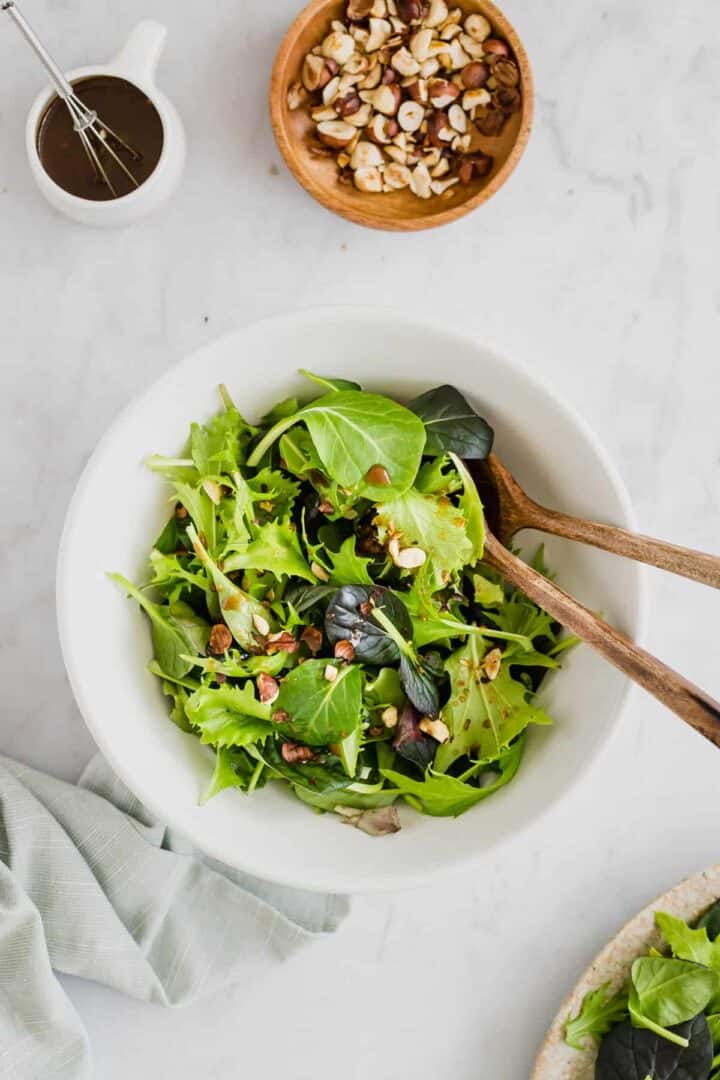 green salad served with toasted hazelnuts