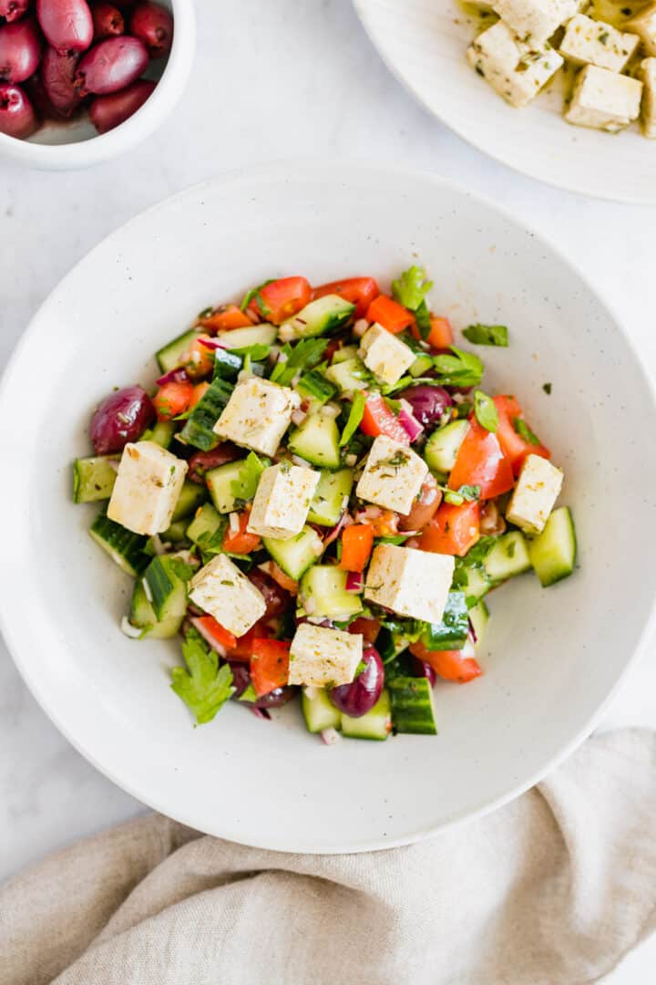mediterranean greek salad with vegan tofu feta on top