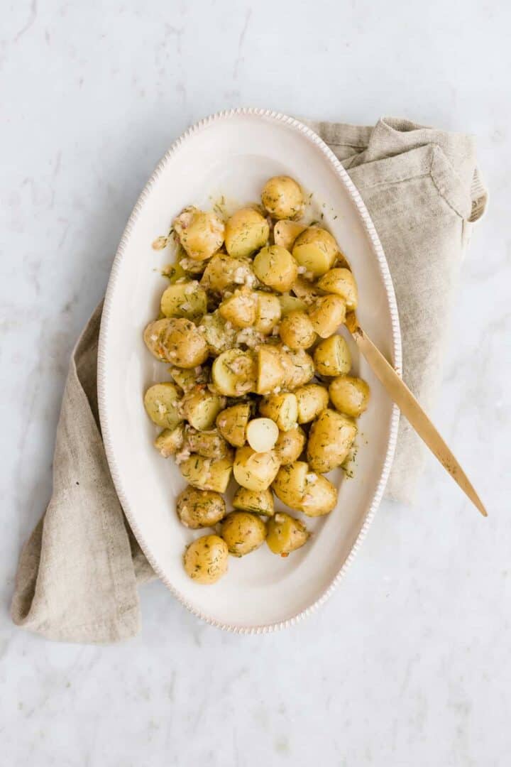 german potato salad served in a white plate