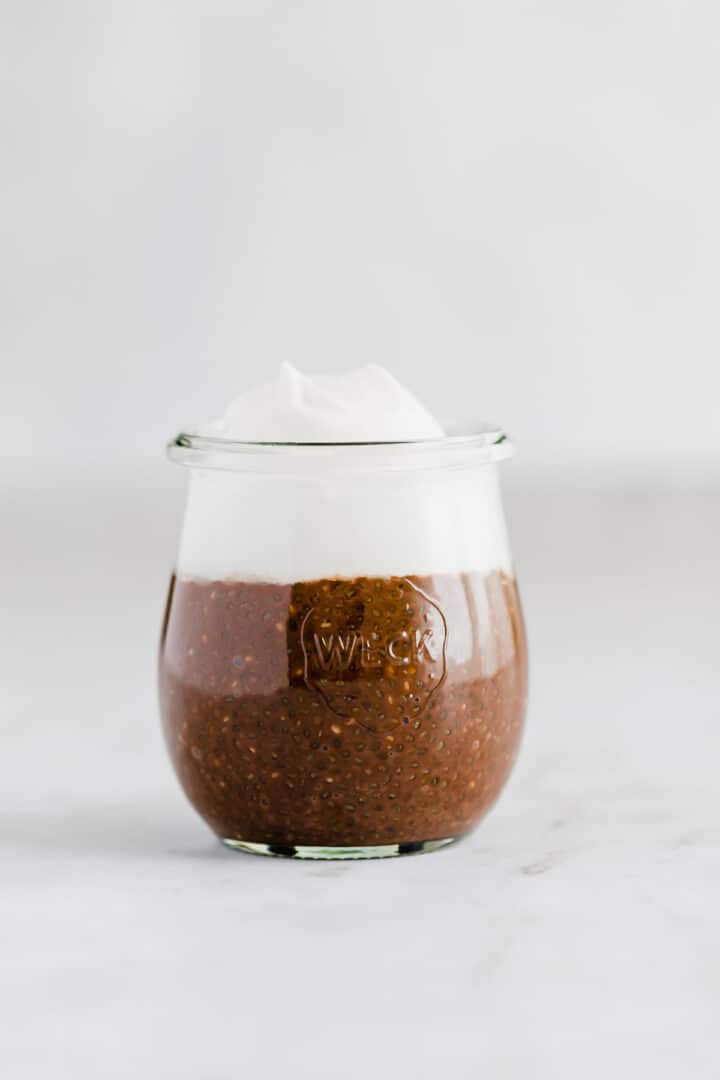 chocolate chia pudding with dairy-free whipped cream on top