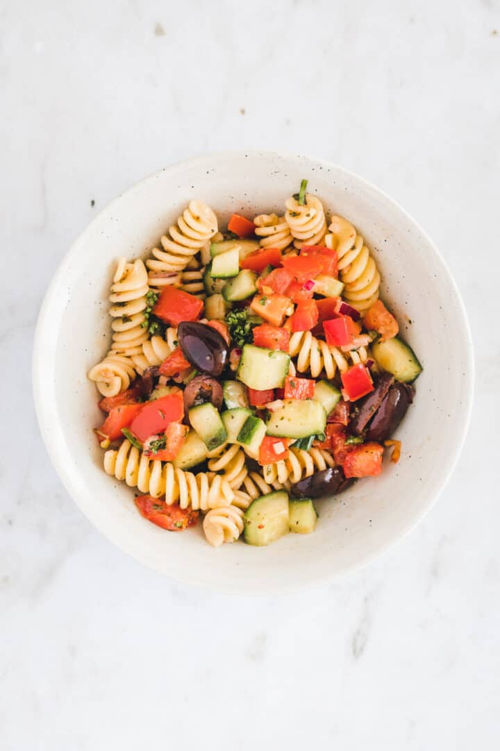 greek pasta salad in a small bowl