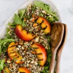 grilled peach salad on a serving platter
