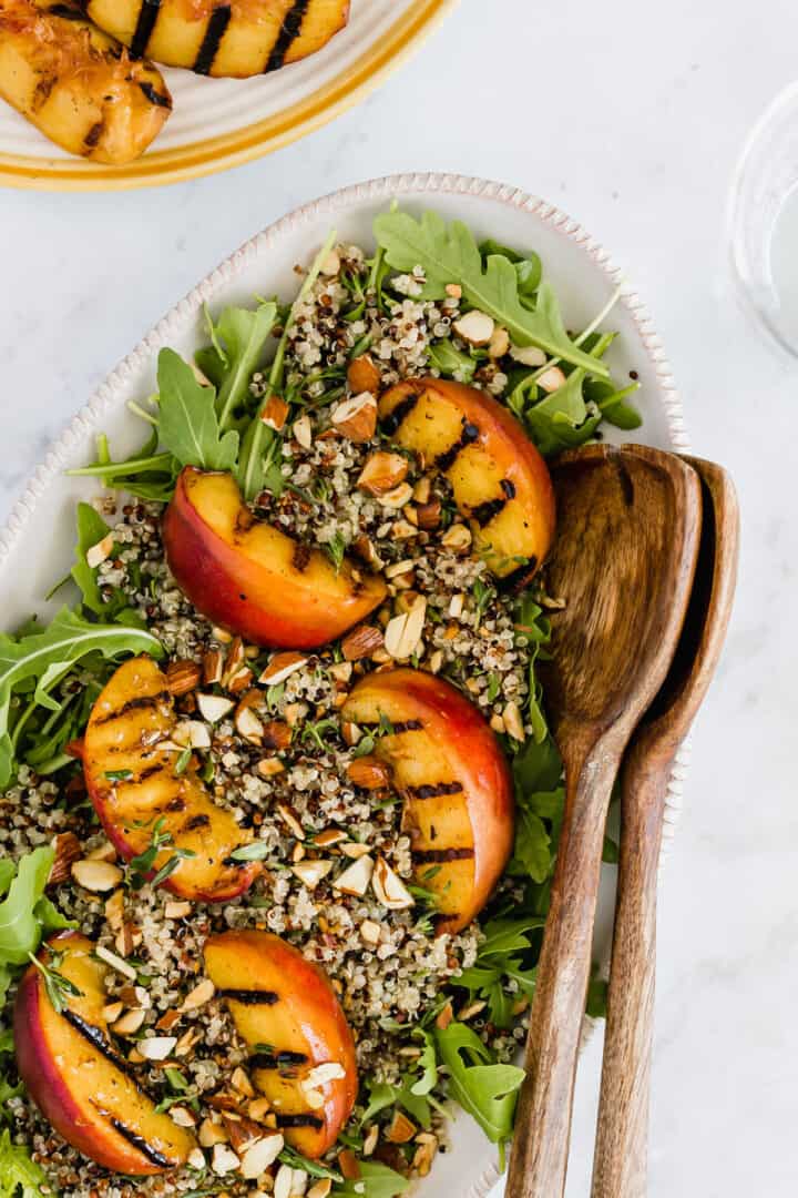 grilled peach salad on a serving platter