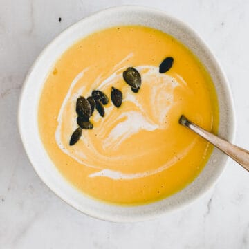 butternut squash soup with coconut milk in a blue bowl