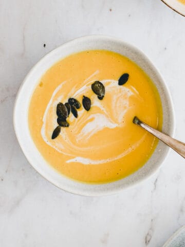 butternut squash soup with coconut milk in a blue bowl