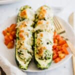 vegetarian zucchini boats filled with rice on a plate