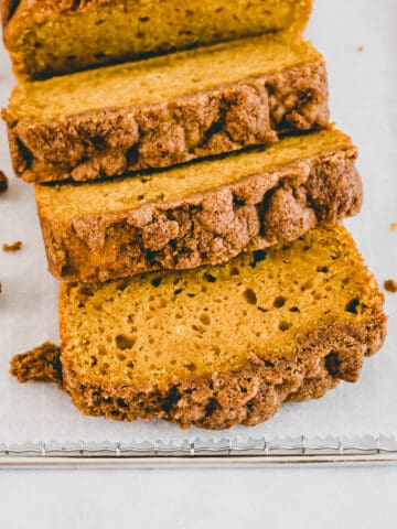 sliced healthy pumpkin bread with streusel topping