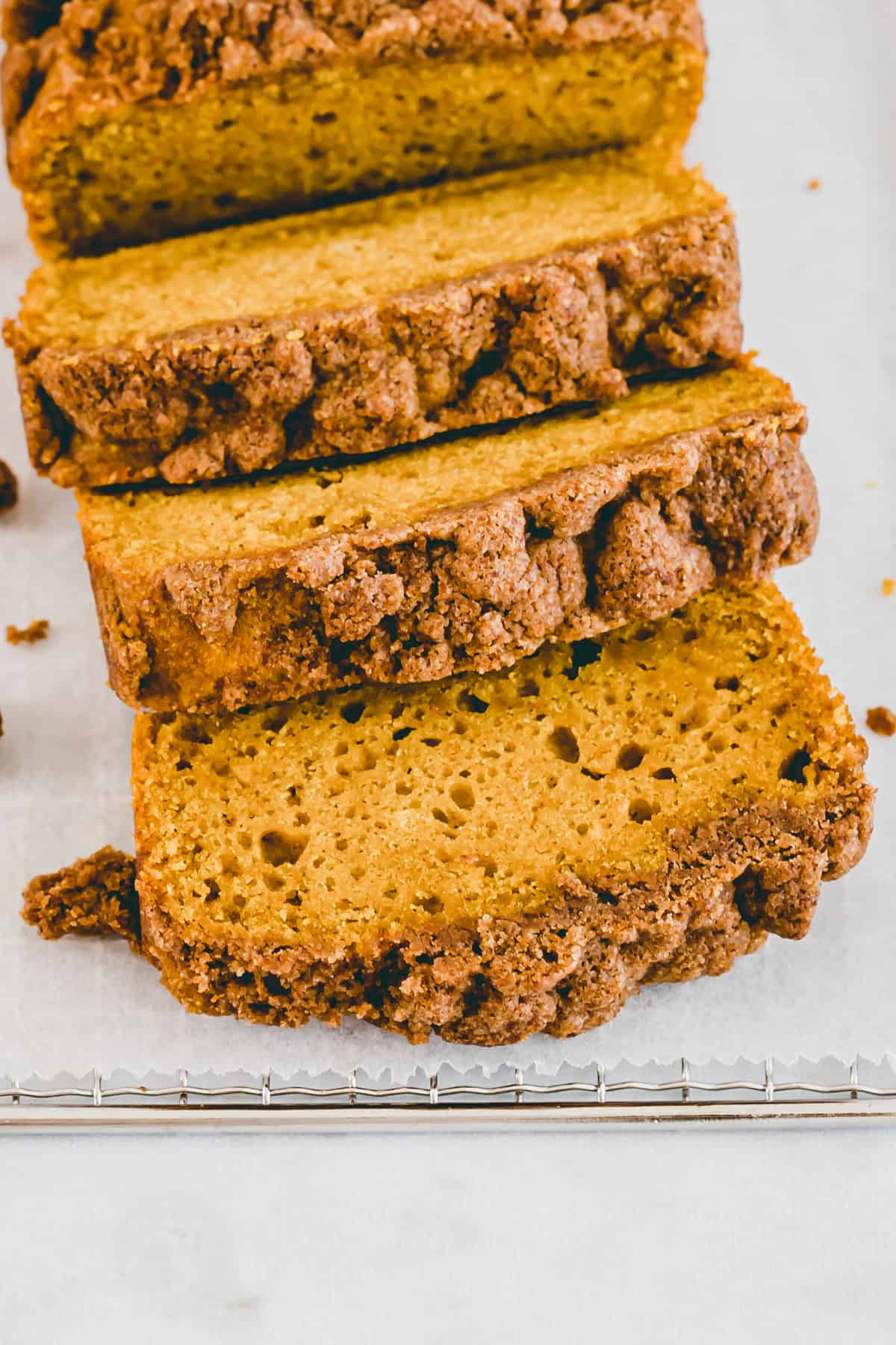 sliced healthy pumpkin bread with streusel topping