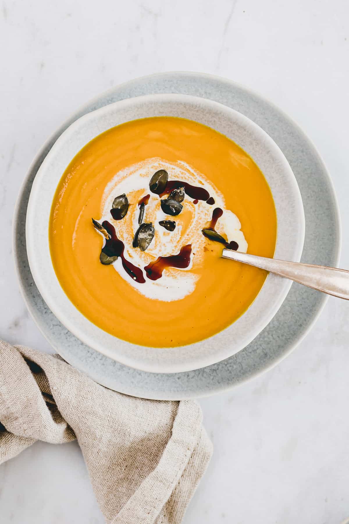 pumpkin and ginger soup topped with coconut milk