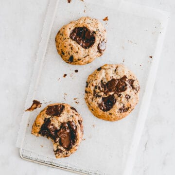 Vegan Oatmeal Chocolate Chip Cookies on a cooling wrack