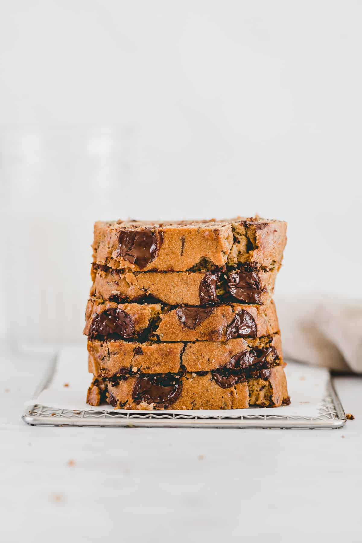 sliced healthy zucchini bread with chocolate chips stacked on top of each other