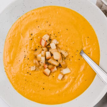 sweet potato curry soup with apple-cinnamon topping