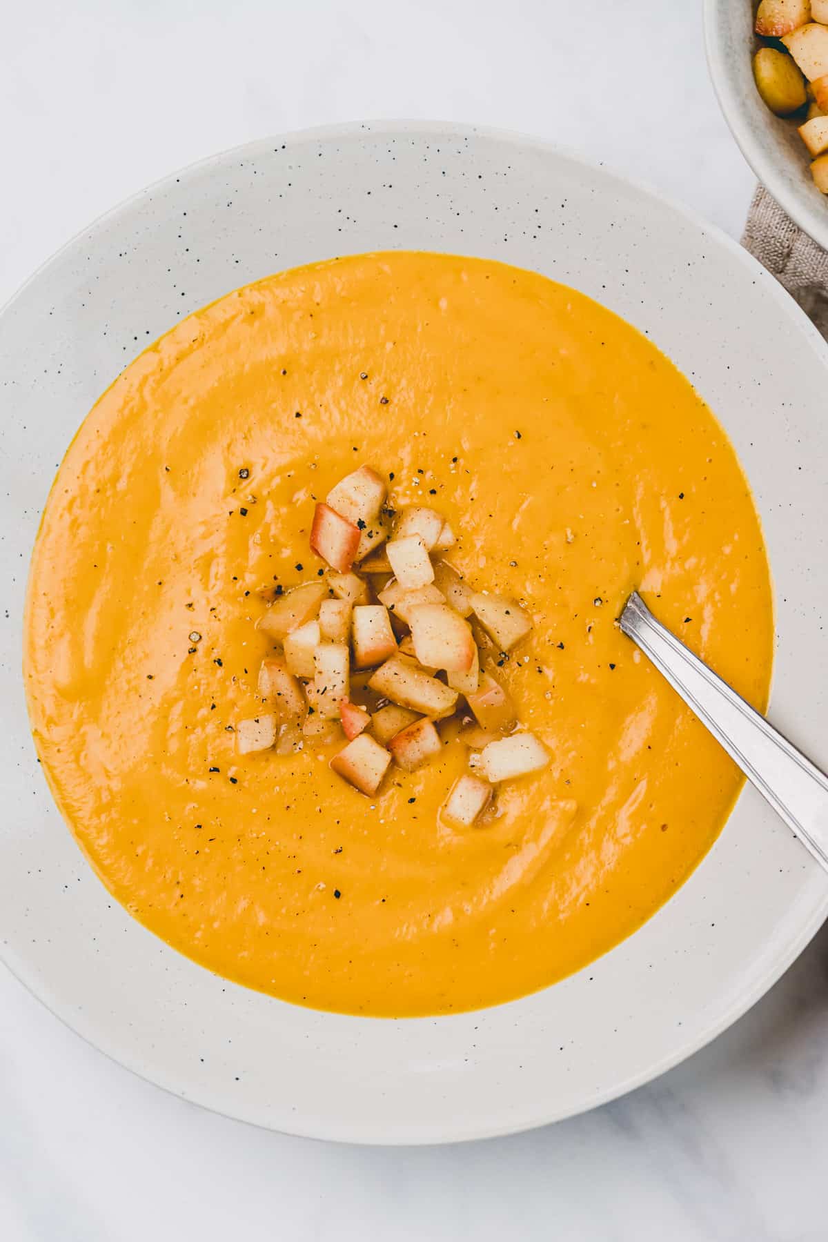 sweet potato curry soup with apple-cinnamon topping