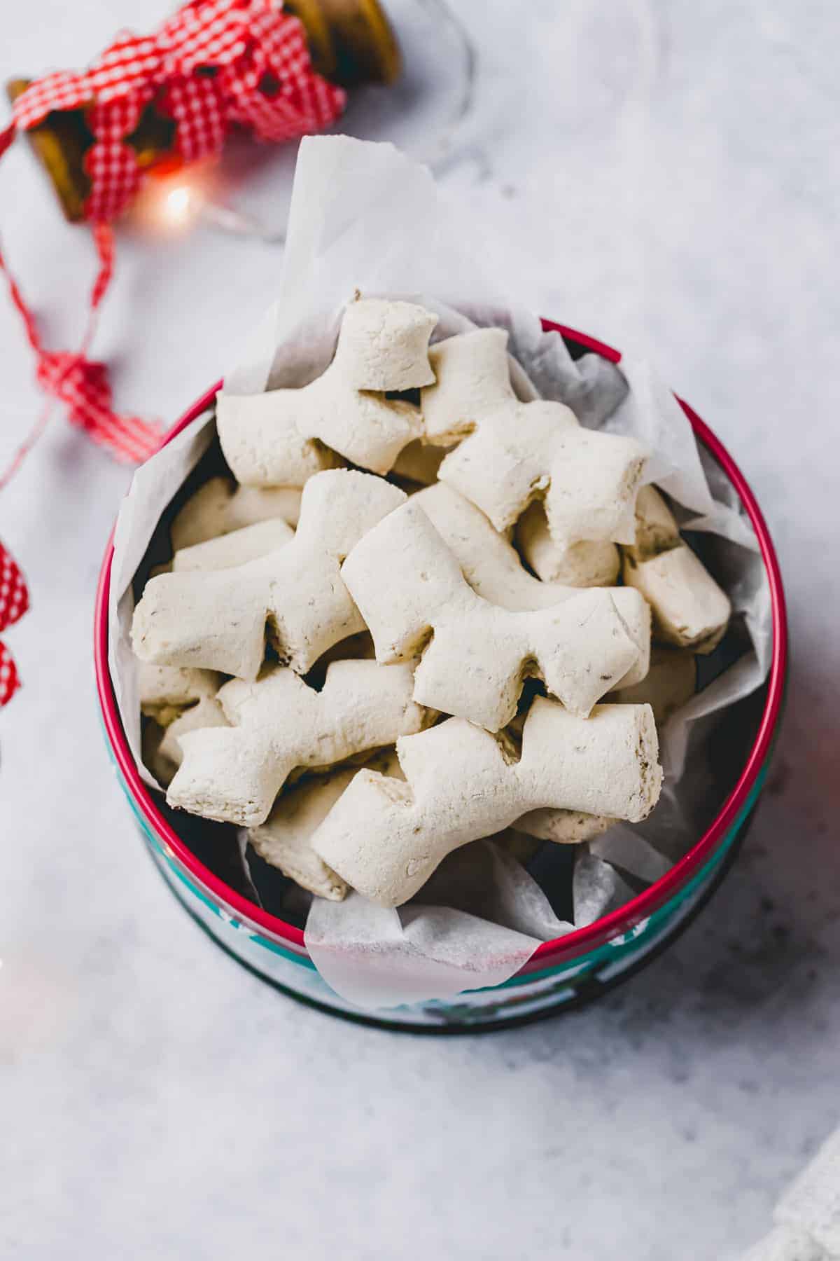 swiss anise cookies in a cookie tin