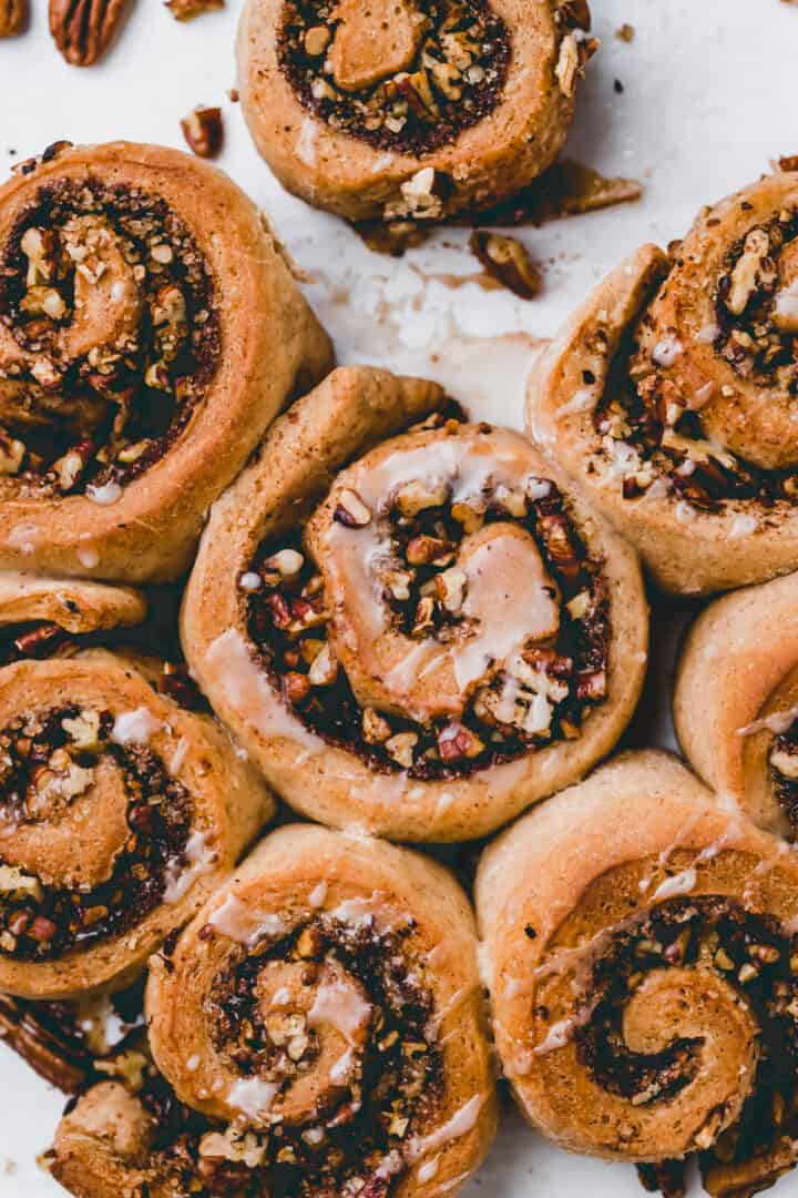 macro shot of vegan cinnamon buns filled with brown sugar and pecans