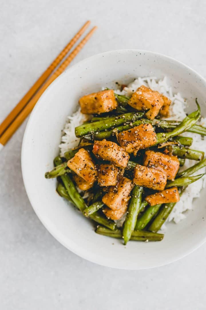 black pepper tofu with green beans on rice