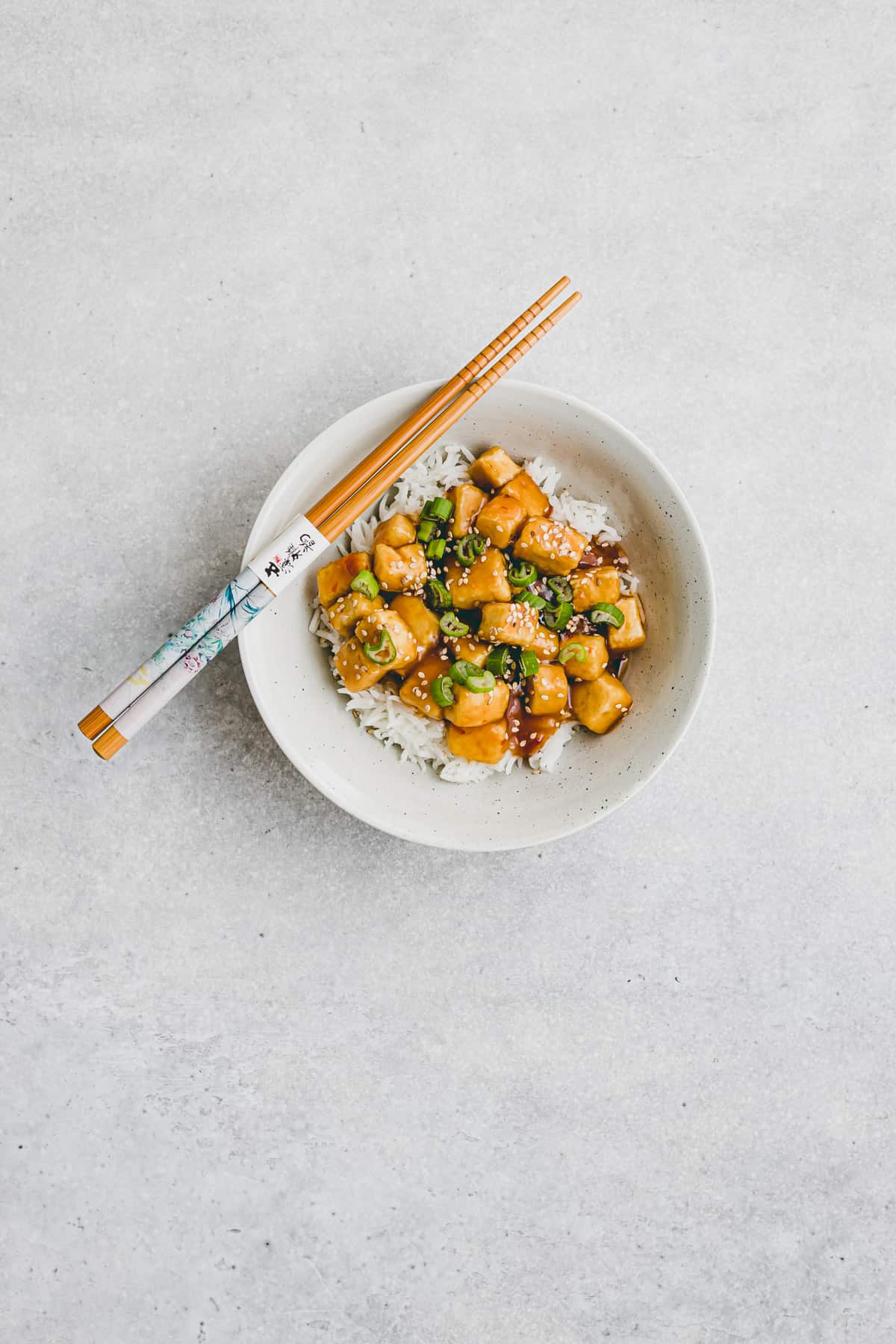 tofu orange chicken with panda express orange sauce in a bowl