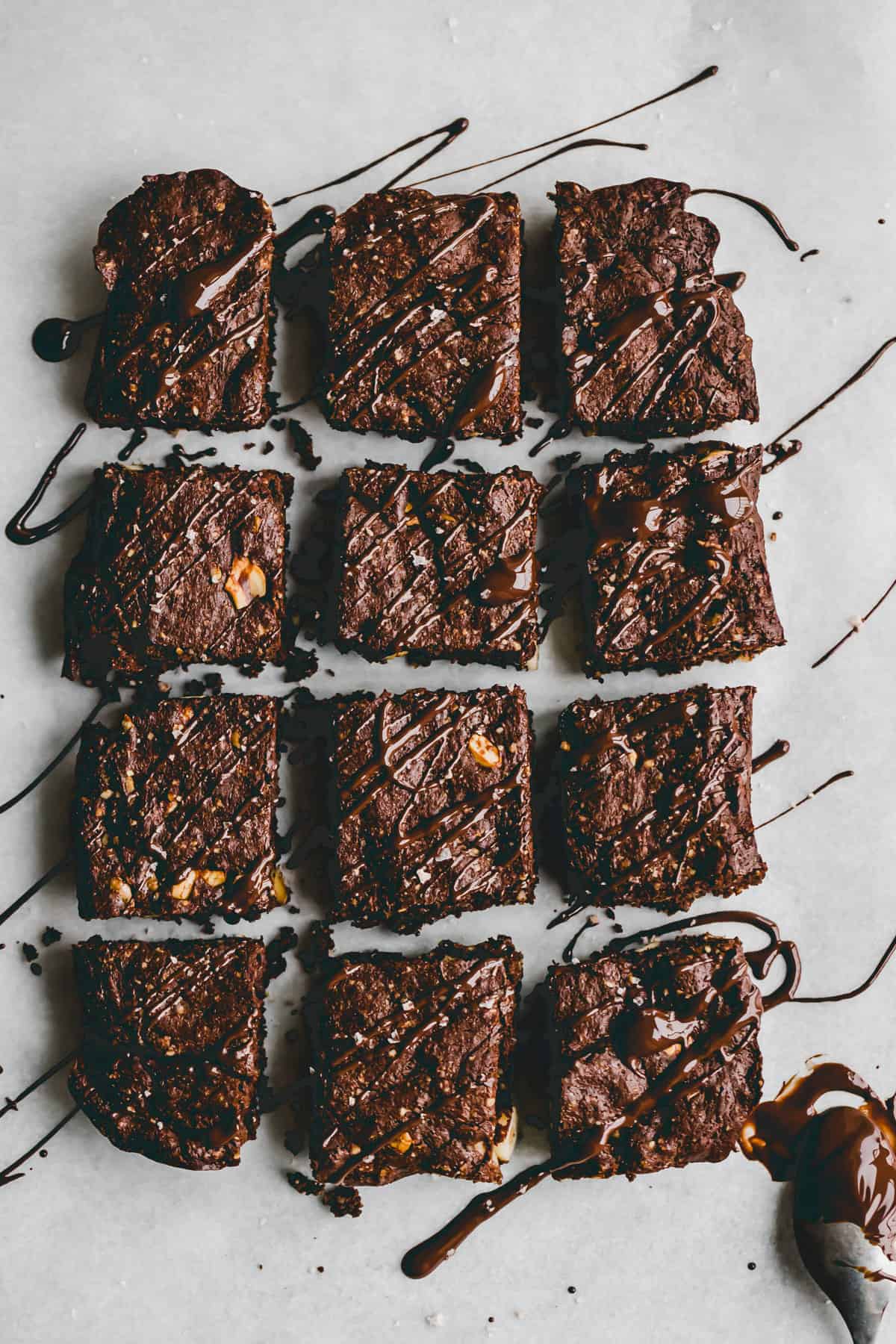 sliced gluten-free brownies drizzled with chocolate