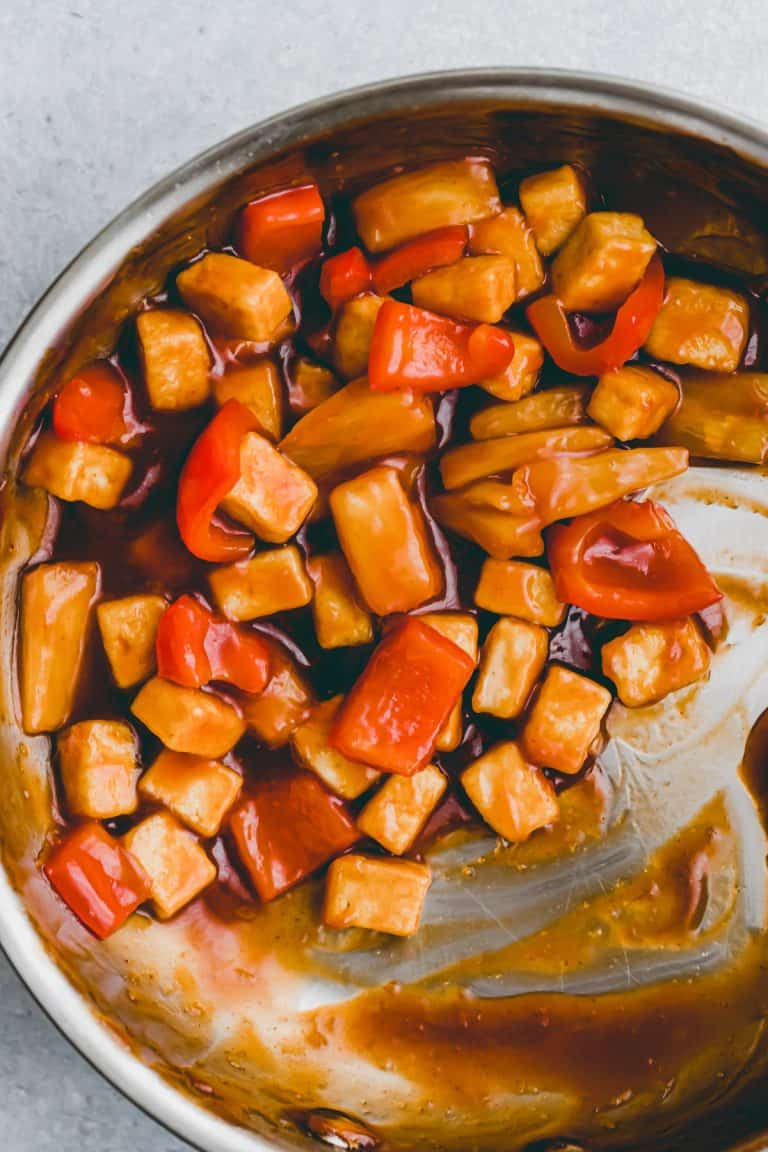 a bowl of tofu sweet and sour with rice