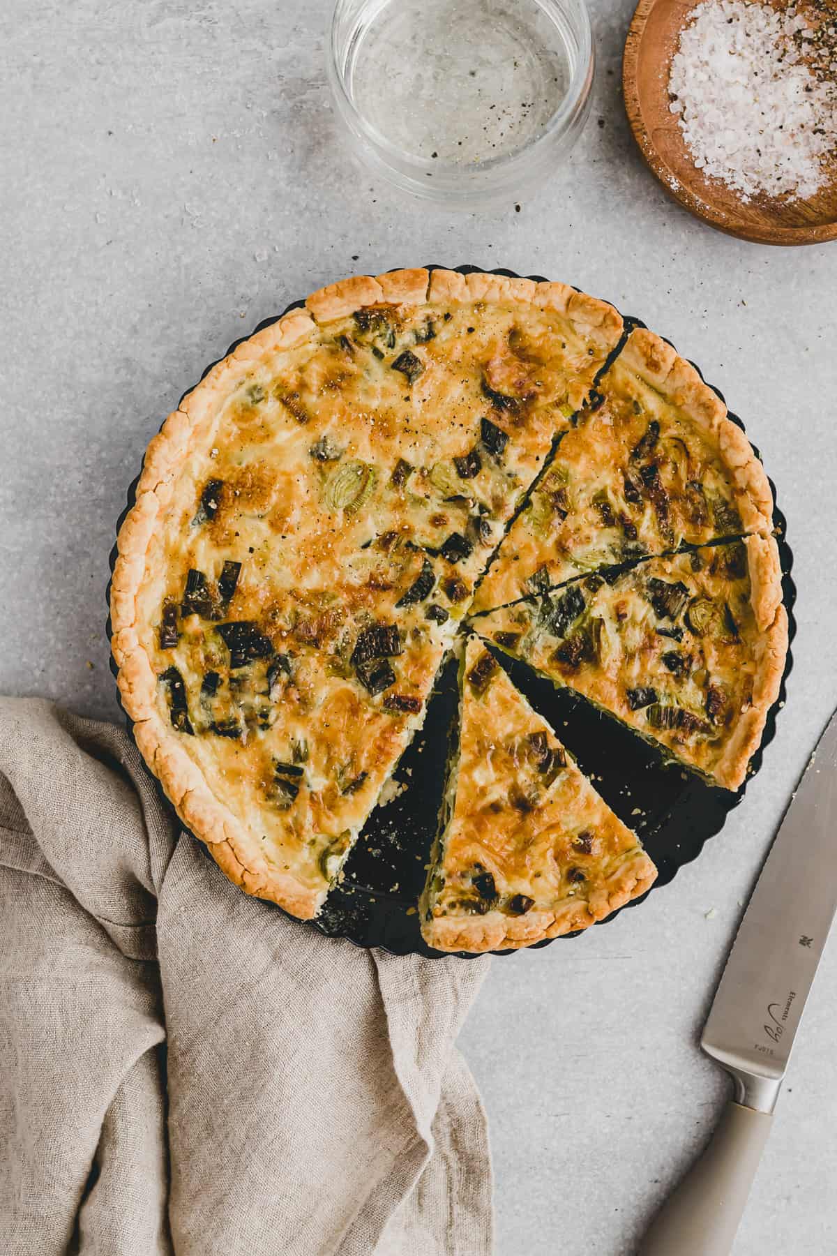 sliced vegetarian leek quiche with a homemade quiche crust