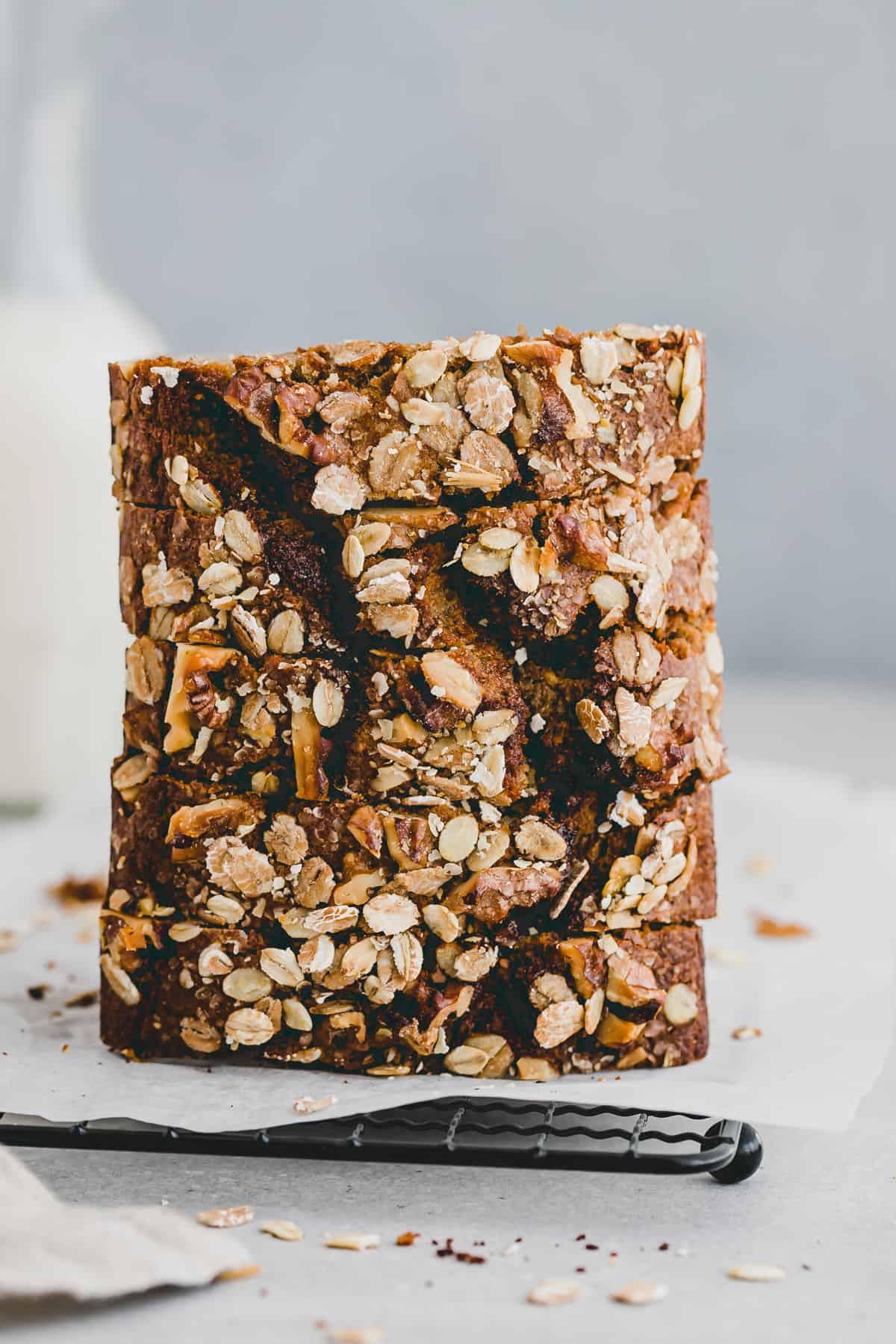 slices of walnut banana bread stacked on top of each other