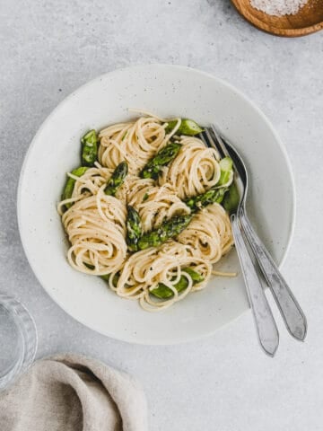 Asparagus Carbonara in a bowl with cutlery