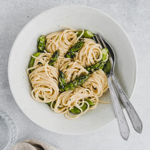 Asparagus Carbonara in a bowl with cutlery