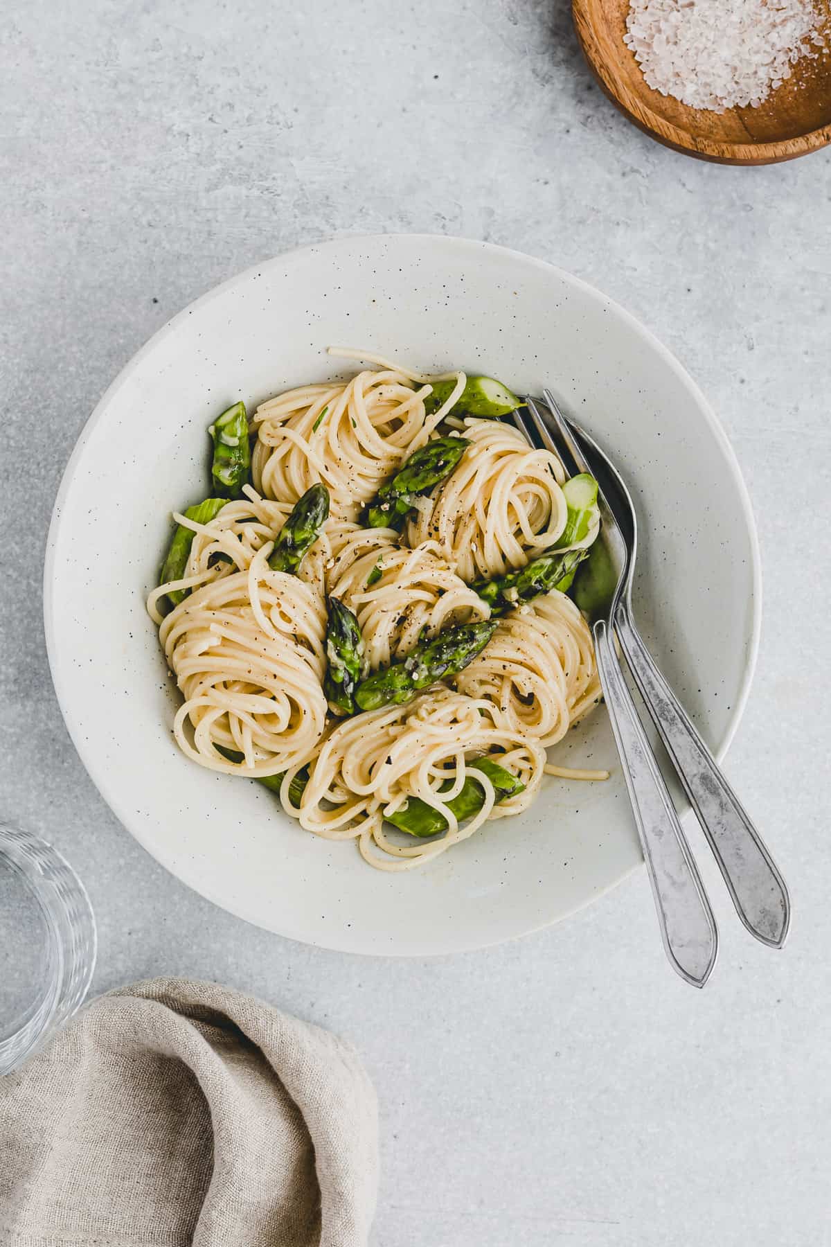 Asparagus Carbonara in a bowl with cutlery