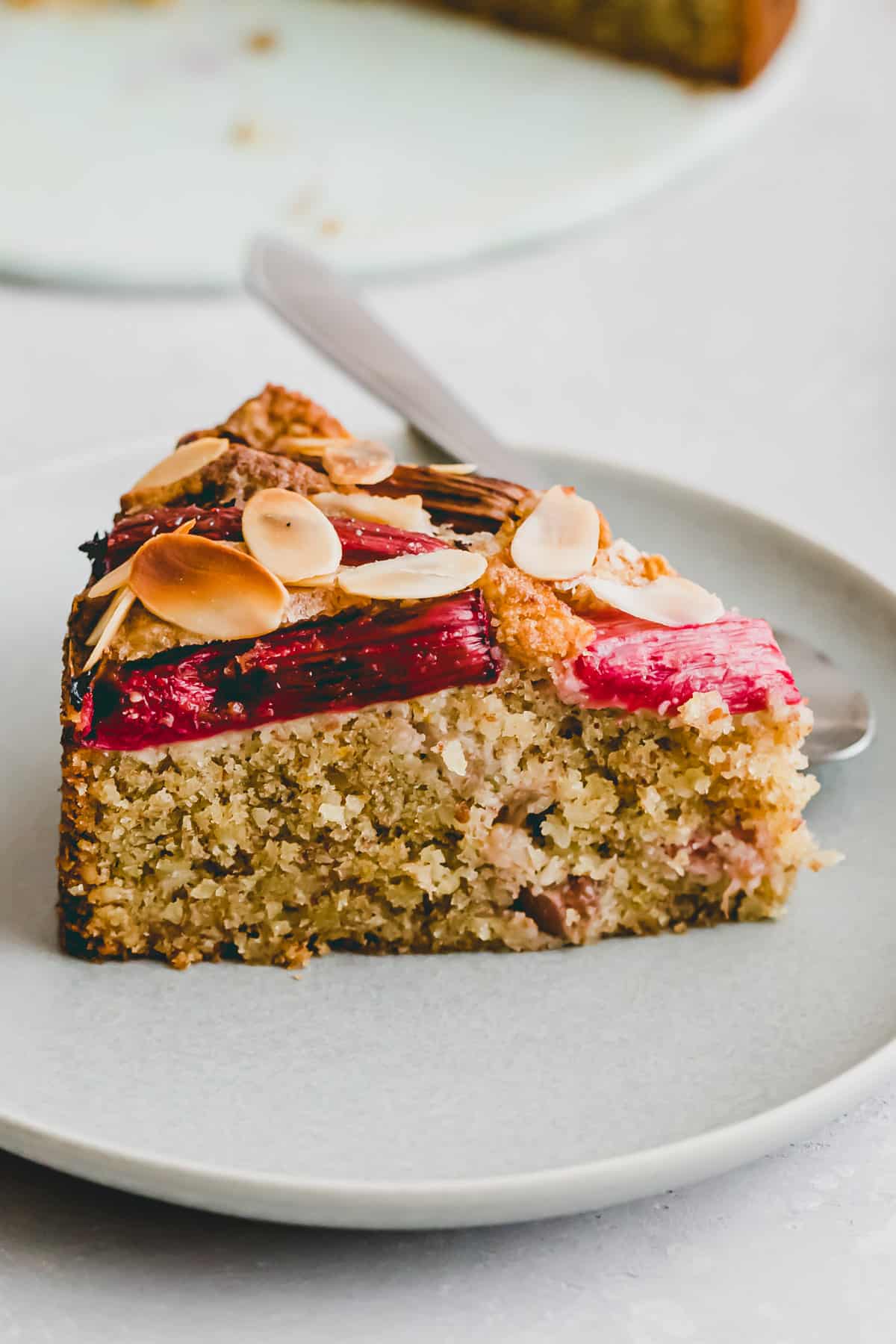 side shot of a slice rhubarb cake