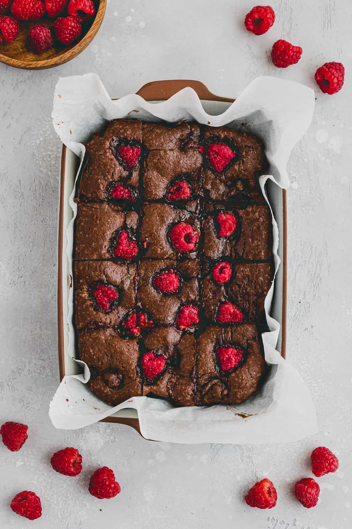 raspberry brownies in a baking pan
