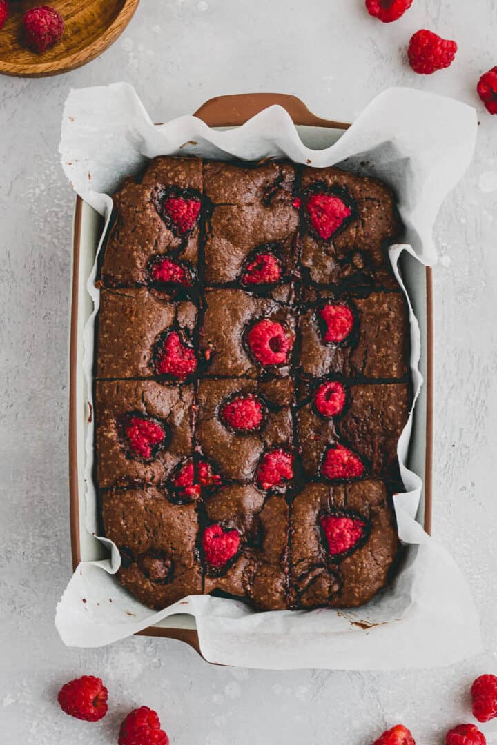 sliced raspberry brownies in a baking pan