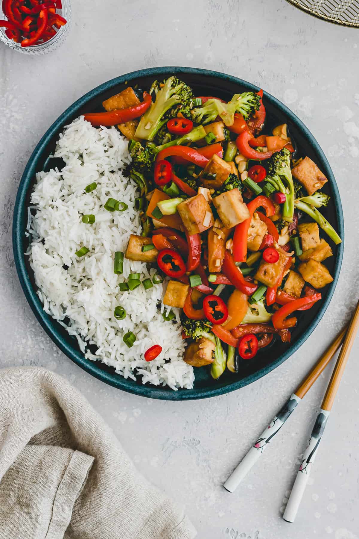 tofu veggie stir fry on a blue plate