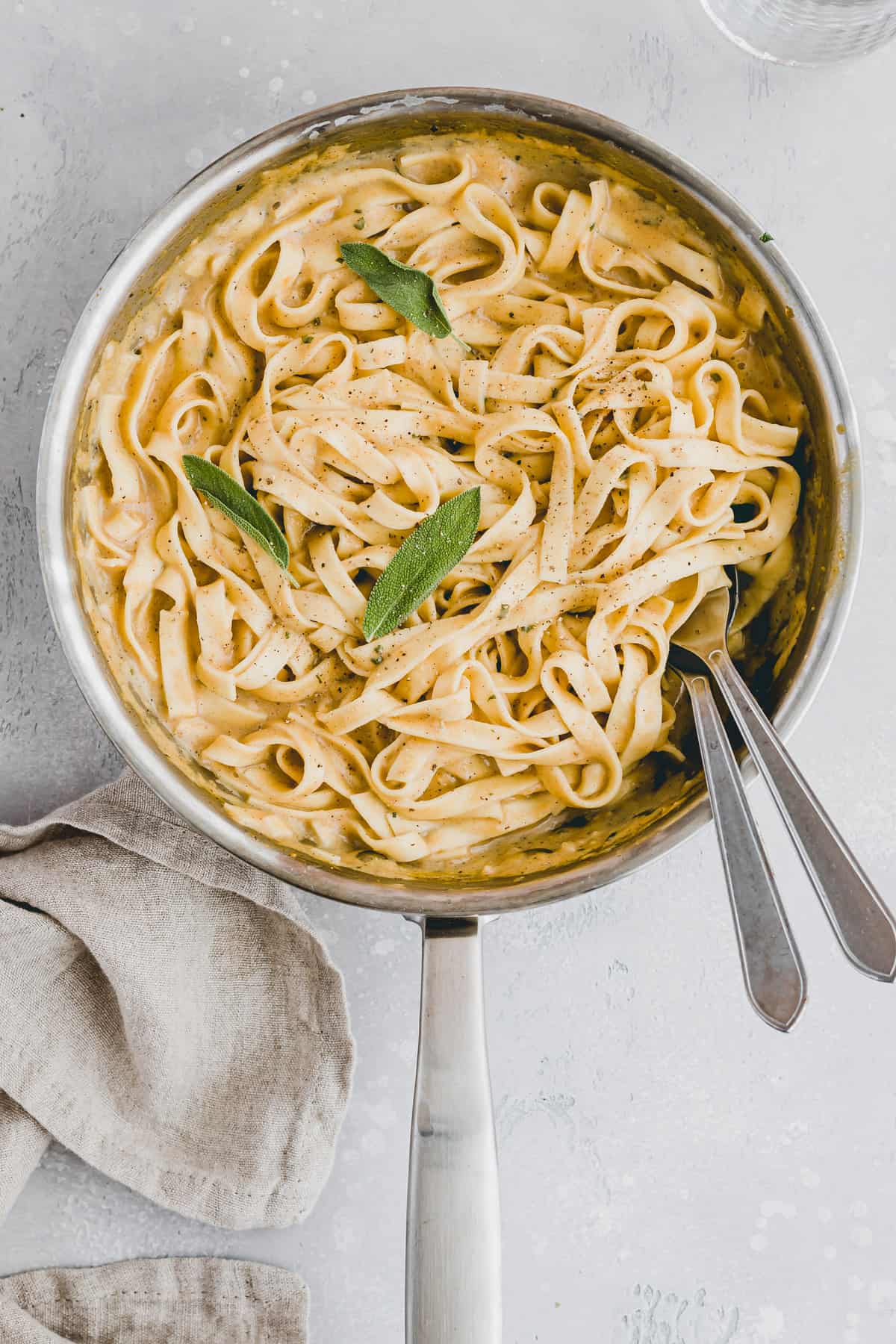 vegan pumpkin pasta with sage in a skillet