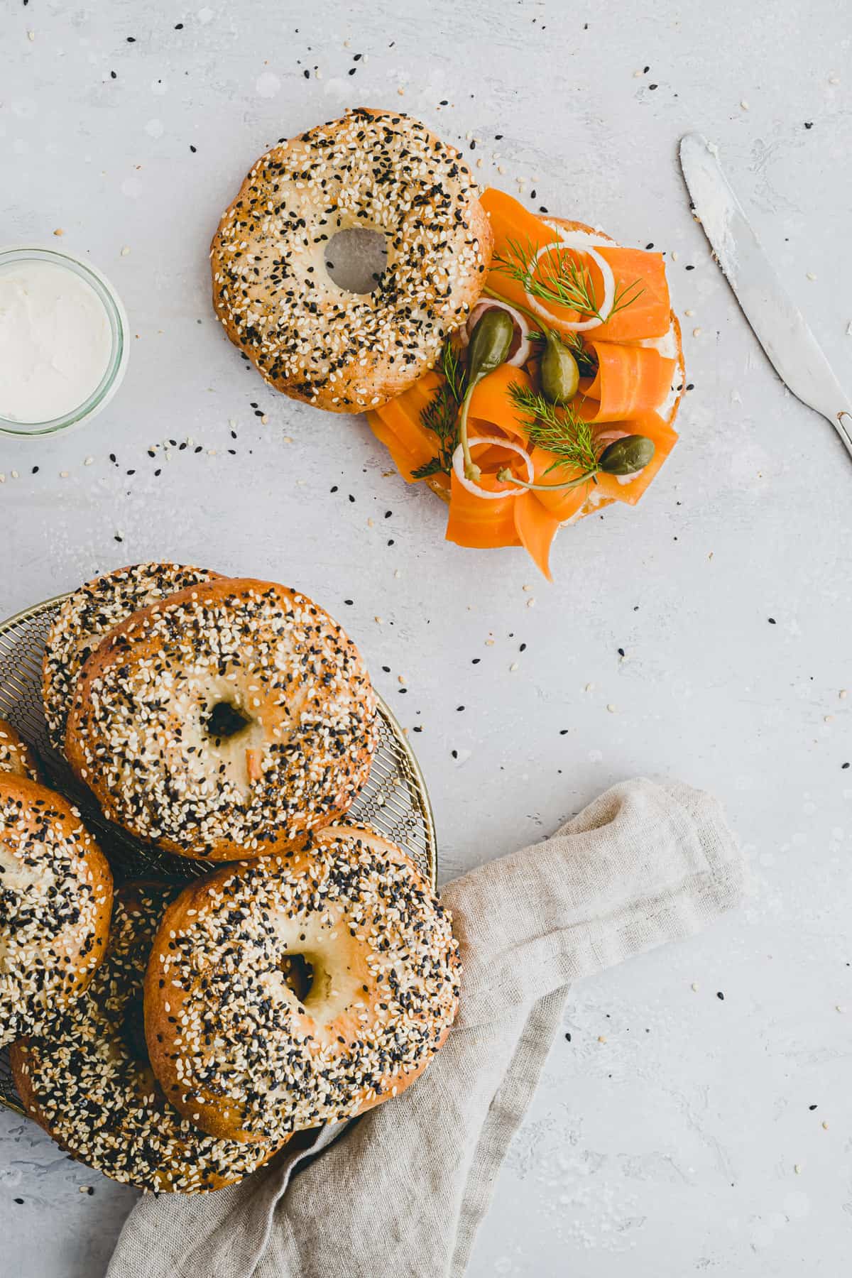 vegan carrot lox bagel next to cream cheese