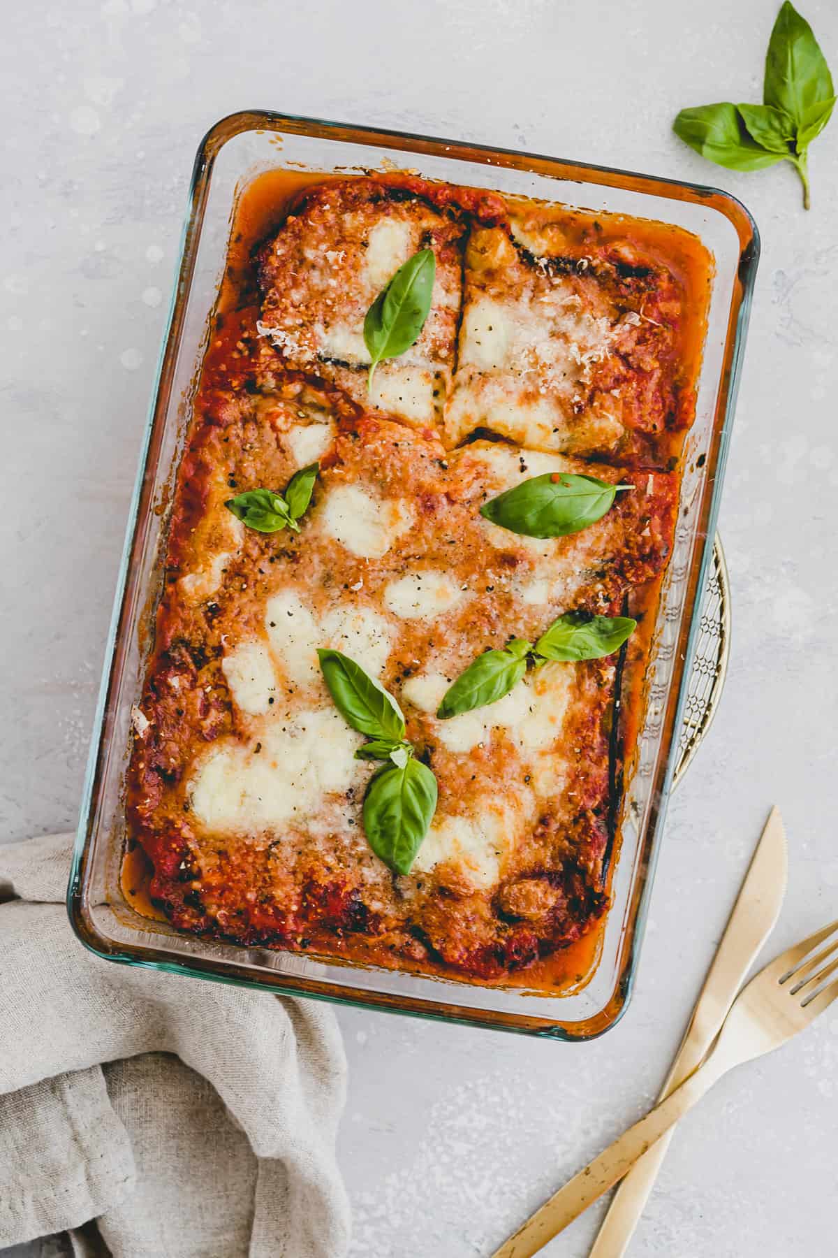 baked eggplant parmesan topped with fresh basil