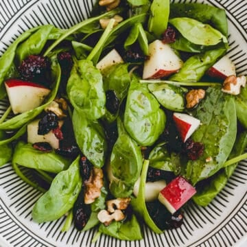spinach apple salad in a bowl
