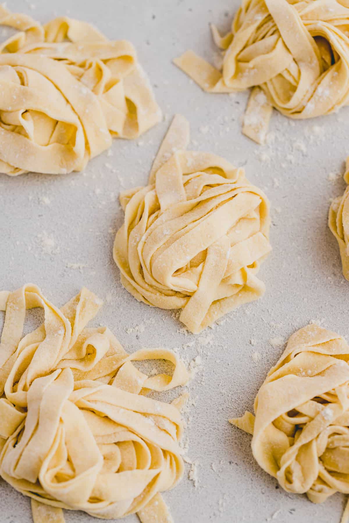 fresh pasta dough cut into noodles