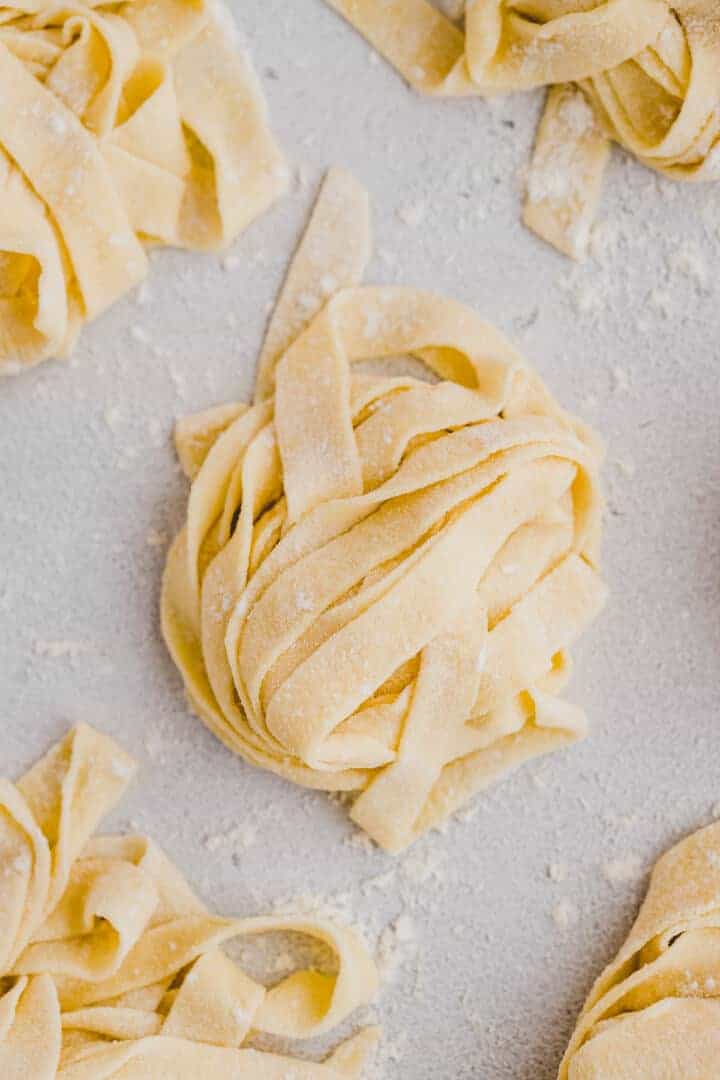 homemade pasta dough cut into noodles