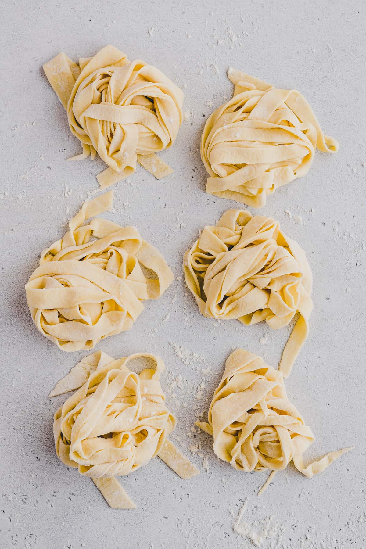 fresh pasta dough cut into noodles