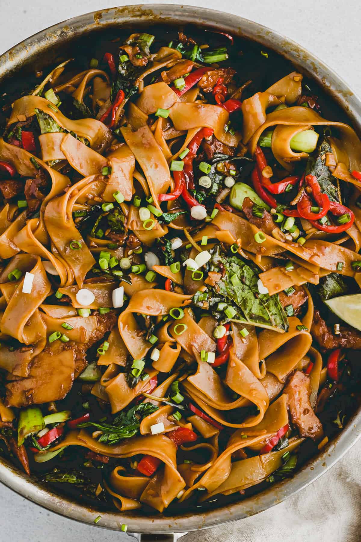 pad kee mao noodles in a skillet