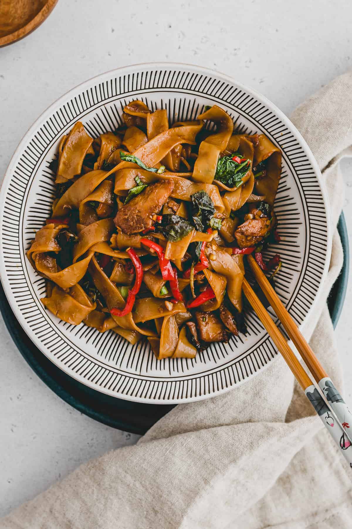 thai drunken noodles with chopsticks