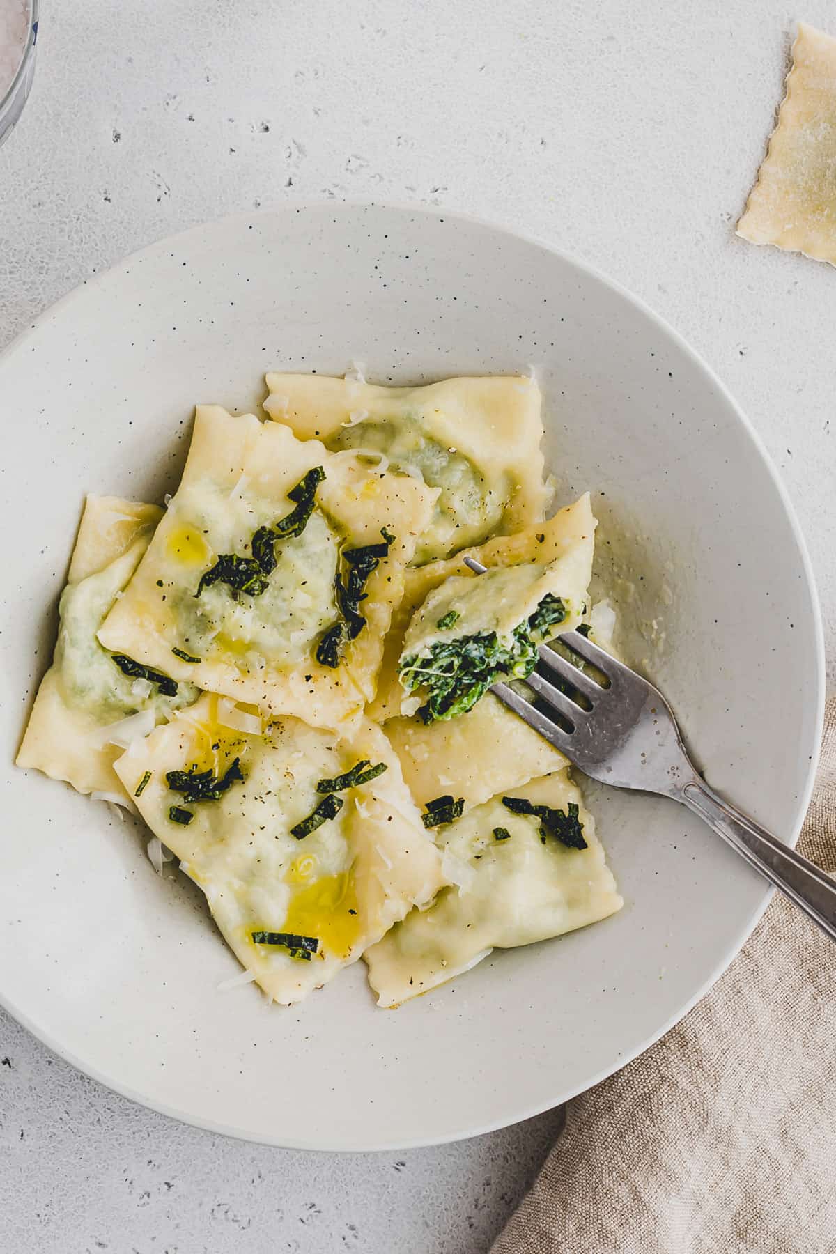 ravioli with spinach ricotta filling on a plate