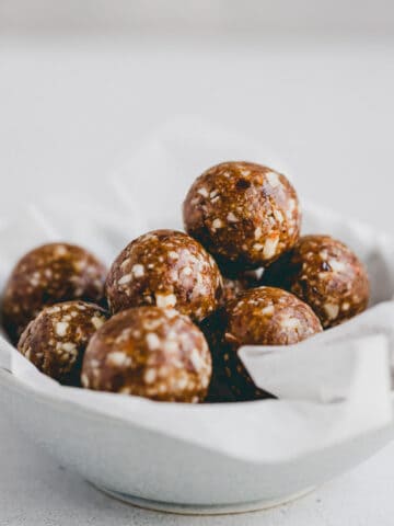 gingerbread energy balls in a small bowl