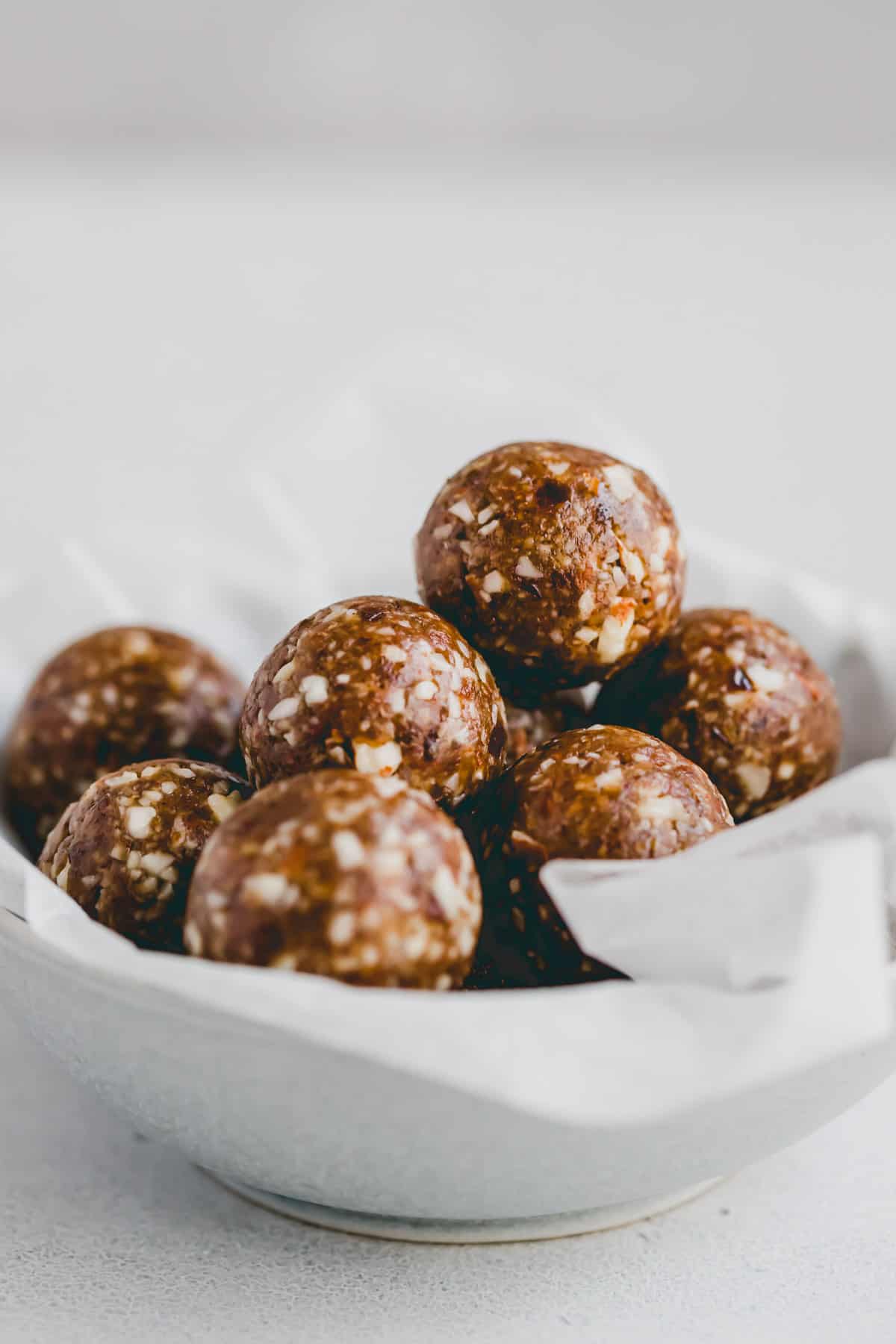 gingerbread energy balls in a small bowl