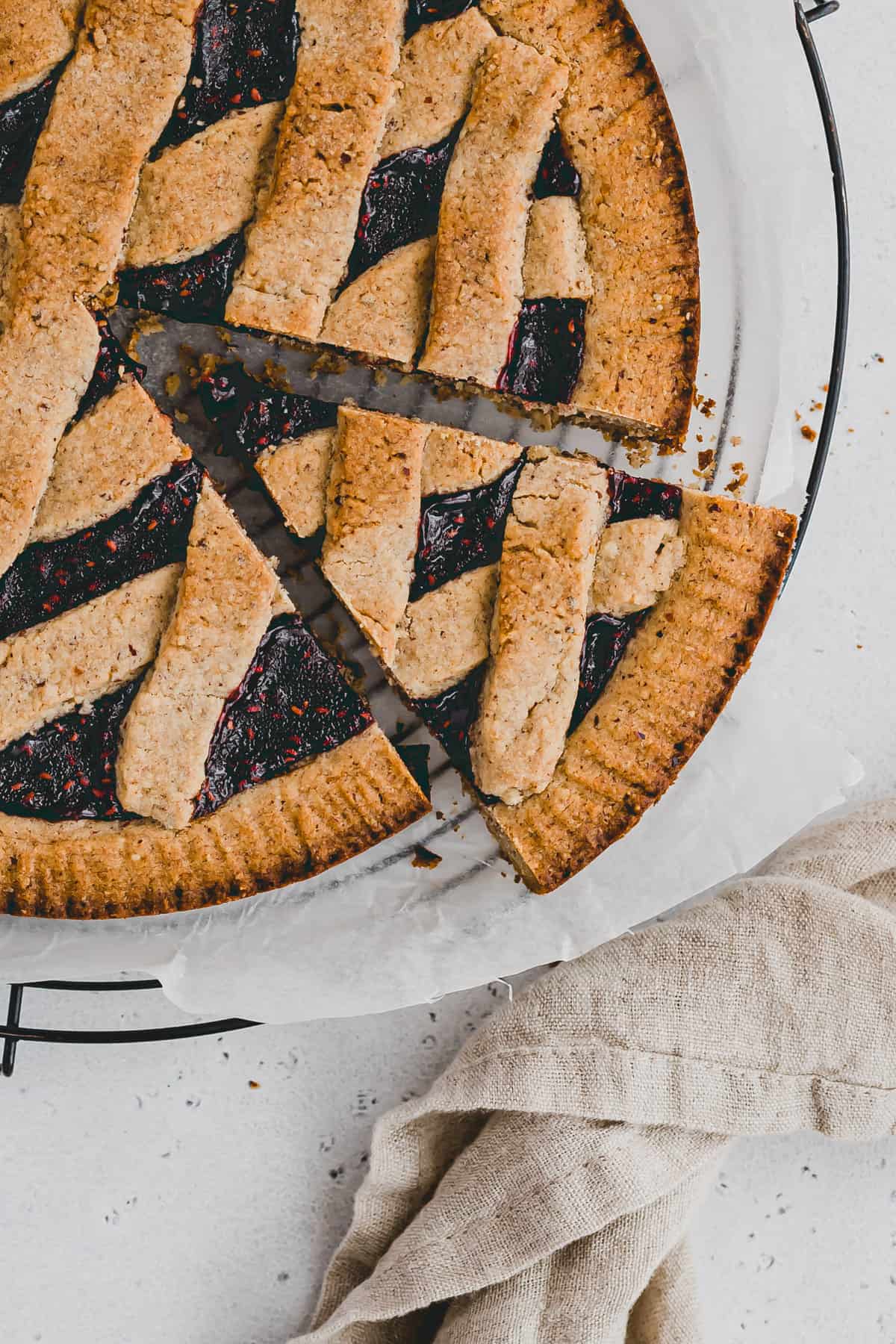 a slice of linzer torte on a wire rack