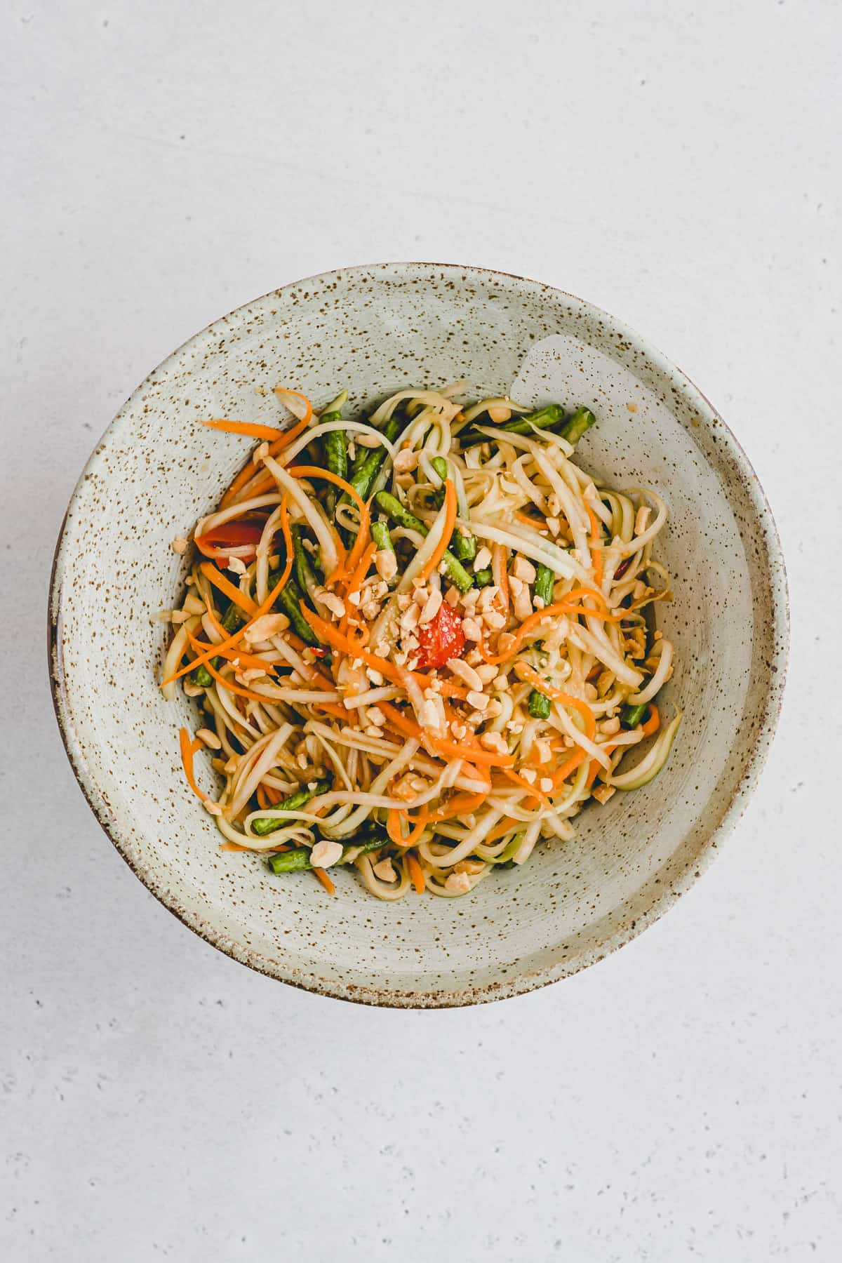 vegan green papaya salad in a bowl